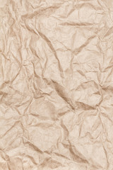 Crumpled beige paper background. Old brown  paper texture as abs
