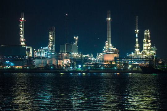 scenic of petrochemical oil refinery plant shines at night