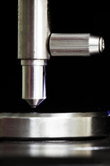 Indenter of rockwell scale c testing with calibration block