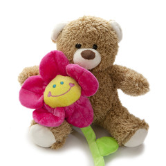 ours en peluche et fleur souriante