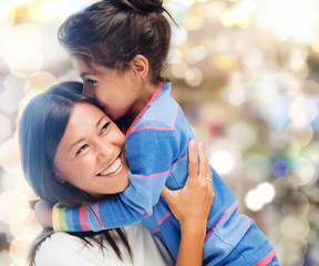 hugging mother and daughter