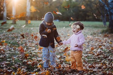 brother and sister in the autumn park