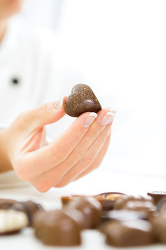 Women chef holding a Chocolate Heart