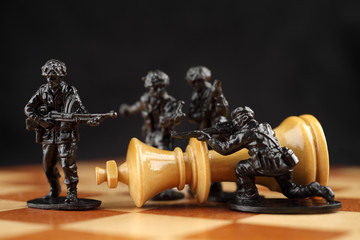 Toy soldiers kill chess King