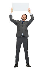 smiling businessman with white blank board