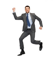 smiling businessman jumping