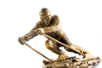 Gold ski champion statuette award isolated on white background