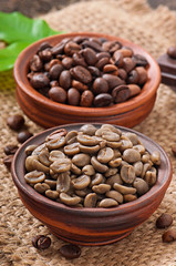Green and brown coffee beans in bowls