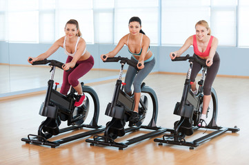 Cycling on exercise bikes.