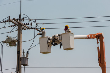 Electricians on a crane