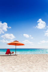 Fototapeta premium Umbrella and chair on the beach