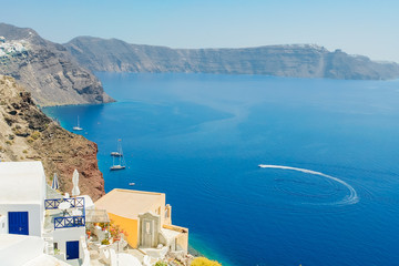 Fototapeta na wymiar View of the sea with the high coast of the island of Santorini