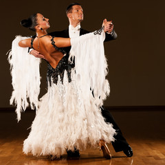  Professional ballroom dance couple preform an exhibition dance - 63343567