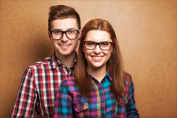 couple of guys dressed in clothes hipsters are in the studio