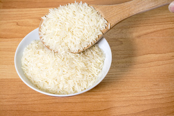 Serving rice with a wooden spoon
