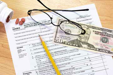 Tax form and objects with a pencil