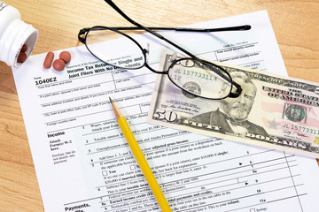 Fototapeta premium Tax form and objects with a pencil