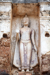Fototapeta na wymiar Ancient buddha statue. Sukhothai Historical Park,Thailand