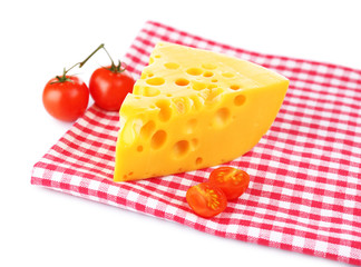 Piece of cheese and tomatoes,on color napkin, isolated on white