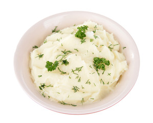 Delicious mashed potatoes with greens in bowl isolated on white