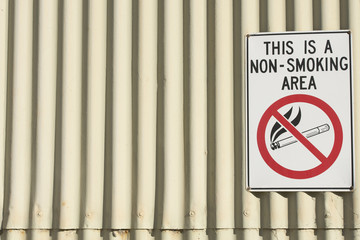 Danger no smoking area sign at building
