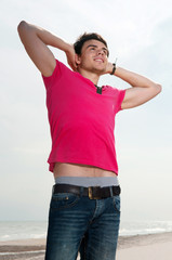 A young man in jeans and a shirt