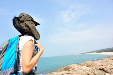   woman hiker enjoy the view at  seaside