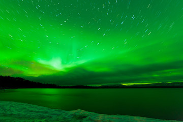 Obraz na płótnie Canvas Aurora borealis starry night sky over Lake Laberge