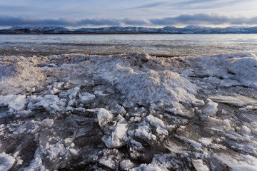 Shore ice piling up Lage Laberge Yukon Canada