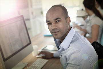Fototapeta premium Portrait of young businessman in office