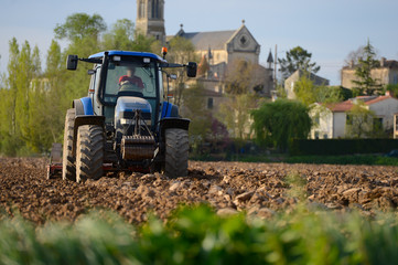 Tractor in plowed field