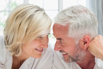Close-up of a happy mature couple in bed
