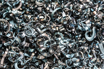 Closeup twisted spiral steel shavings. Drilling industry - obrazy, fototapety, plakaty