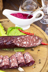 sausage on a wooden plate in a restaurant