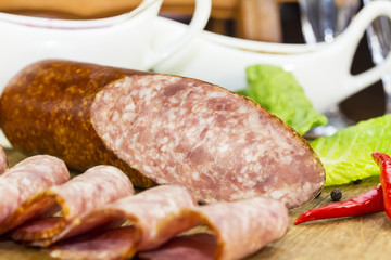 sausage on a wooden plate in a restaurant