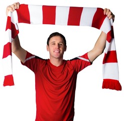Fototapeta Football fan in red holding scarf obraz