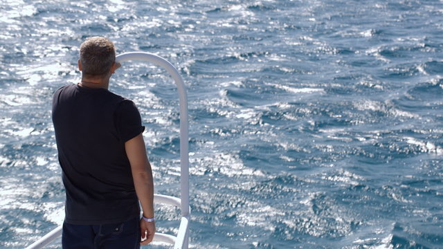 Observing the sea from the yacht