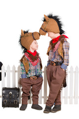 Two boys wearing horse costumes