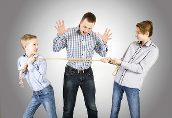 Father and two sons connected by rope