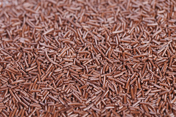 Close up of chocolate sprinkles. Whole background.