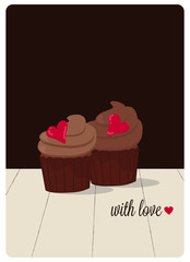 cupcakes with cream cheese frosting decorated with red hearts