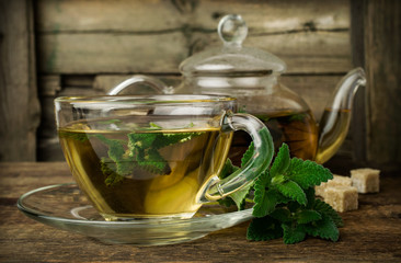 mint tea in glass teapot and cup