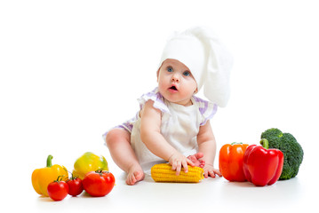 baby chef with healthy  food vegetables