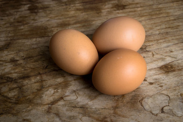 Eggs on wood background