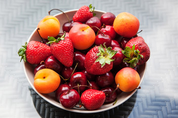 Assorted colorful fresh summer berries and fruits