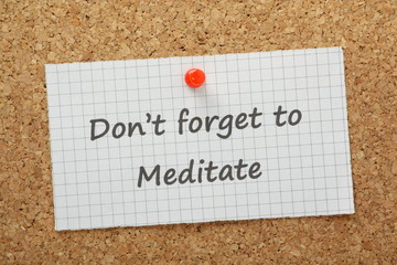 Don't Forget to Meditate reminder on a cork notice board