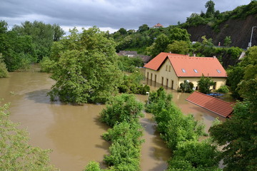 Fototapeta na wymiar Buildings and trees on the Prague suberb during flooding