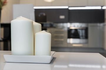 Three candles with defocus kitchen in background