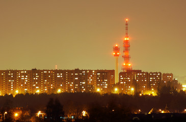 Fototapeta premium Blocks of flats and television tower at night in Poznan .