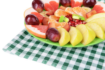 Sweet fresh fruits on plate on table close-up